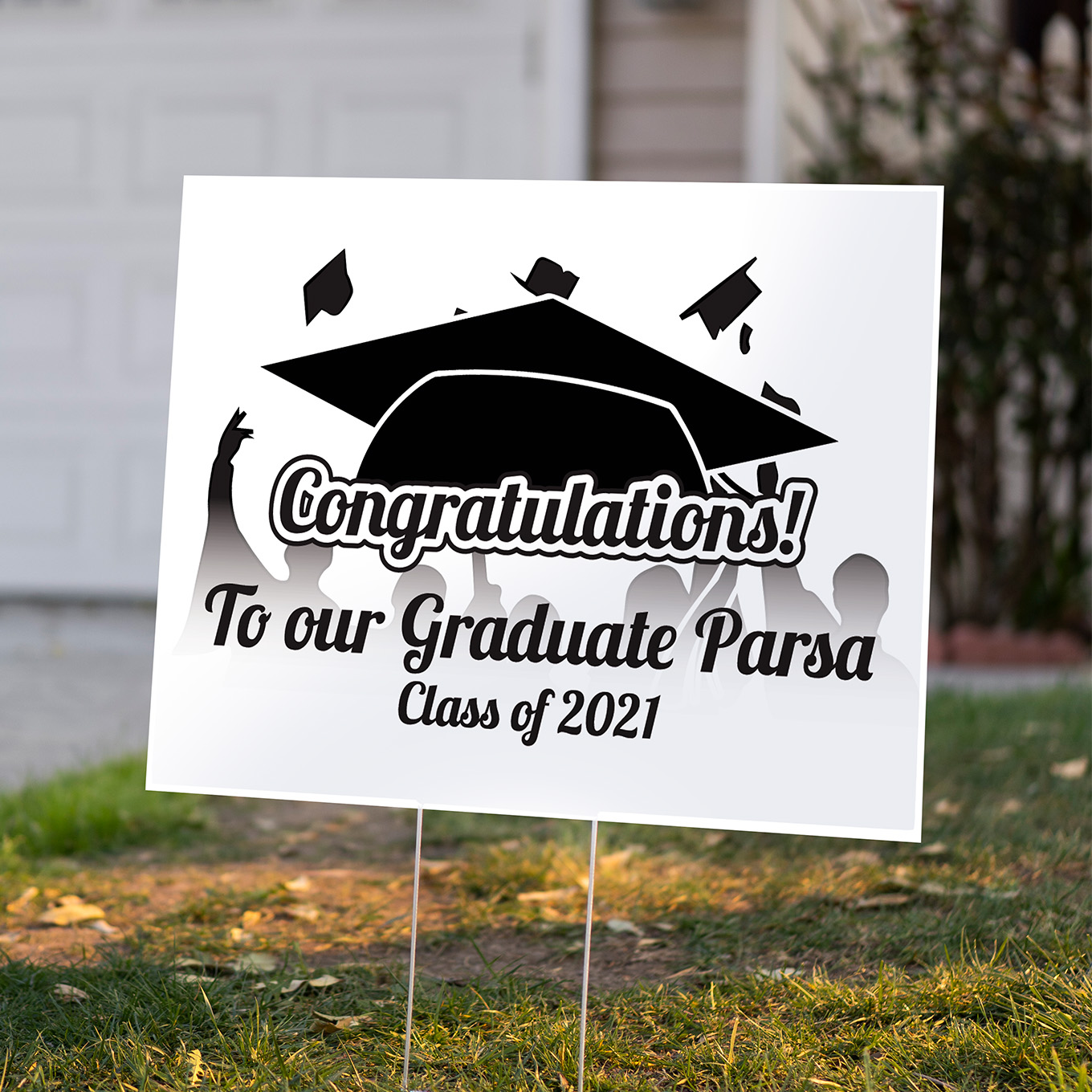 Graduation Lawn Sign Design as a coroplast sign on a H stand on a front lawn.